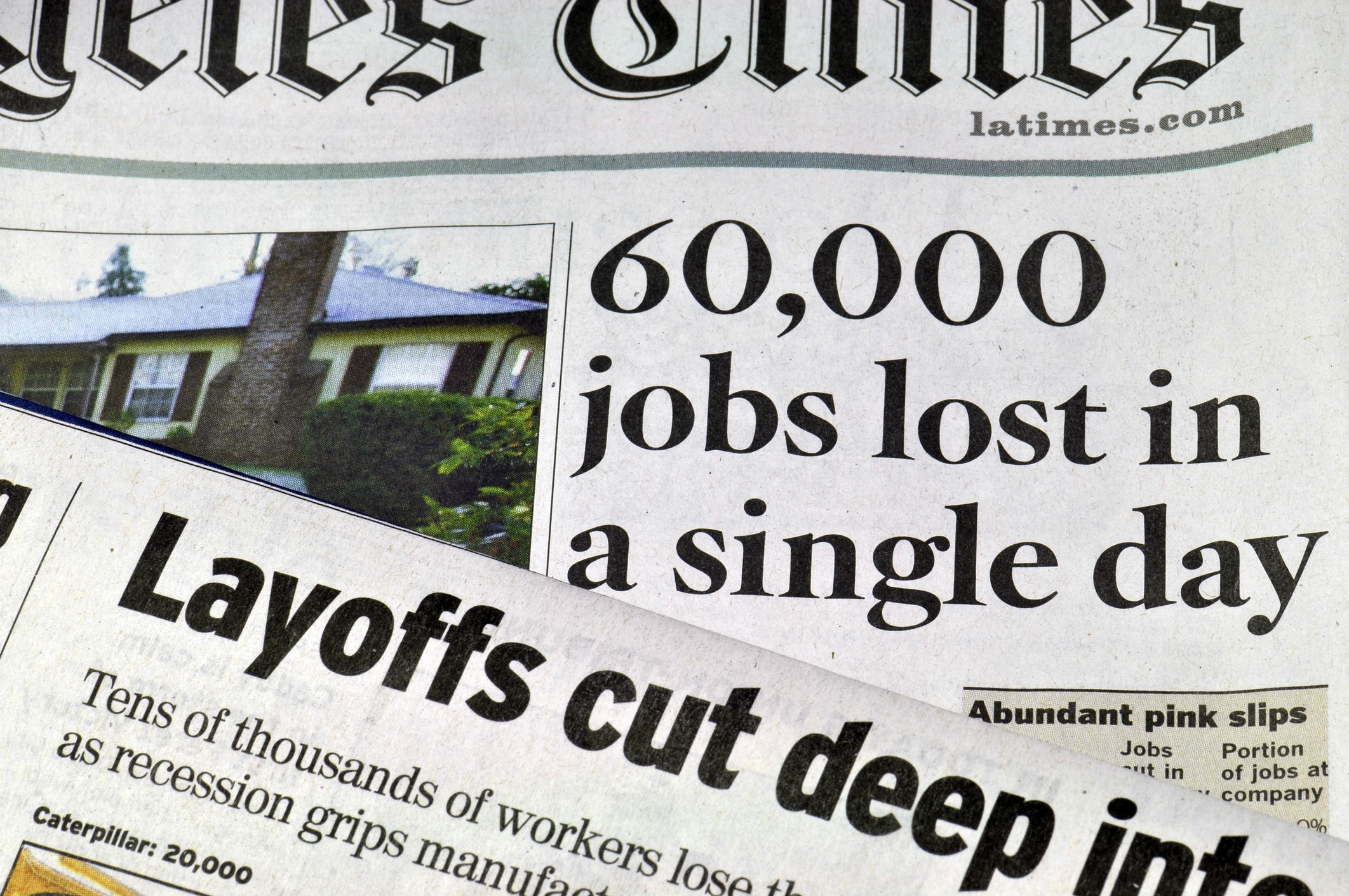 Los Angeles, California, USA - January 27, 2009: Two sets of newspaper headlines, one from the Los Angeles Times documents massives job losses and layoffs. The recession that began in 2008 has continued for several years.