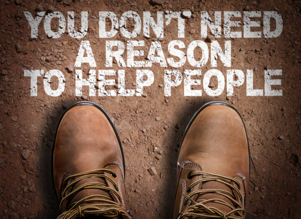 Top View of Boot on the trail with the text: You Don't Need a Reason to Help People